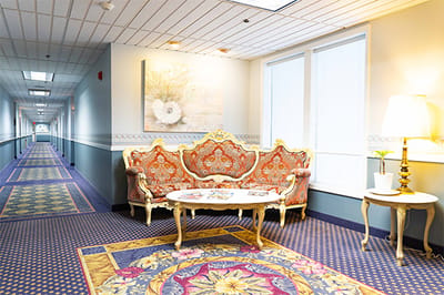 Interior view of a facility's hallway and seating area