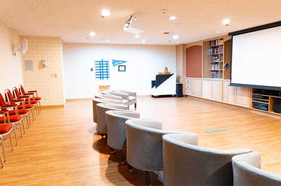 Activity room with chairs and projection screen