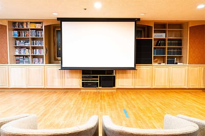 Activity room with a projector and seating