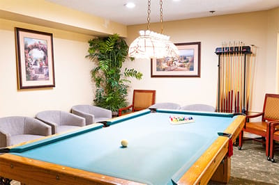 Common area with a pool table and seating