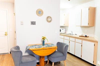 Cozy interior of a resident room with dining table.