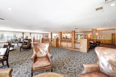 Bright common area with seating and natural lighting