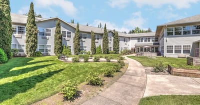 Well-maintained courtyard area with walking paths and greenery