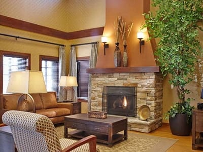 Cozy interior common area with seating and fireplace