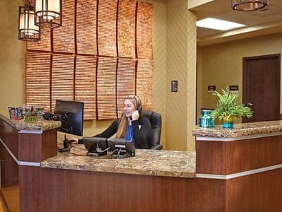 Reception area with staff member at the front desk