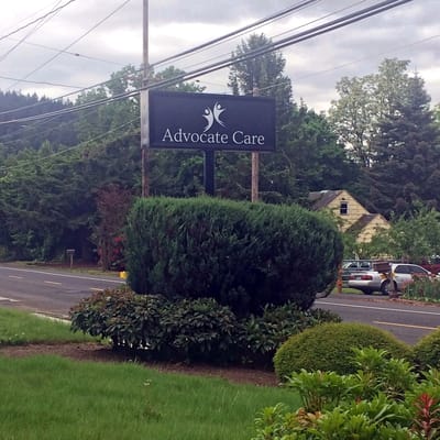 Sign for Advocate Care facility along a road