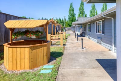 Outdoor space with a wooden gazebo and lawn