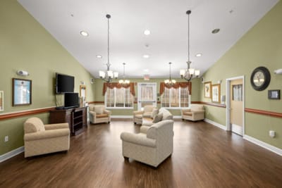 Bright common area with chairs and TV