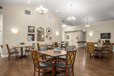 Bright and welcoming common area with dining tables