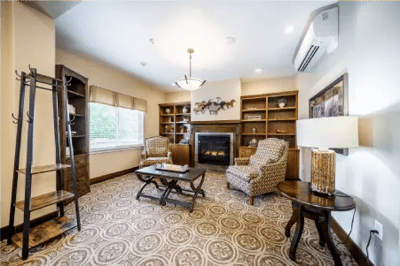 Cozy interior lounge with seating and bookshelves