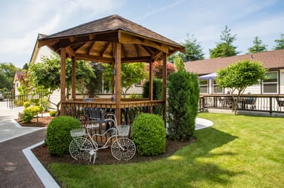 A gazebo in a well-maintained garden