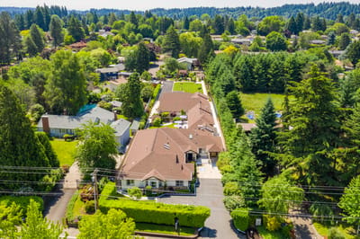 Aerial view of Mapleview Manor with green surroundings