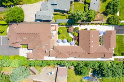 Aerial view of Mapleview Manor's building and gardens