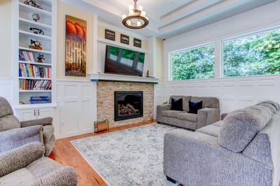 Bright and inviting common area with seating and fireplace