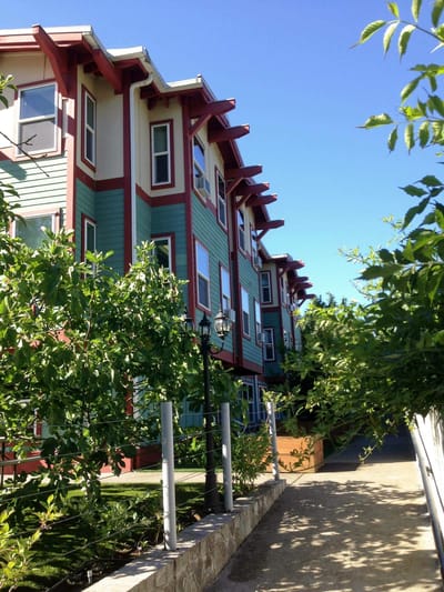 Exterior view of a senior living facility surrounded by greenery
