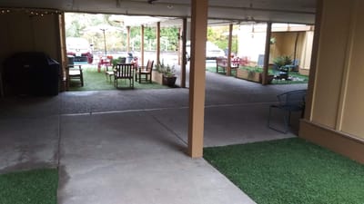 Outdoor seating area with tables and chairs