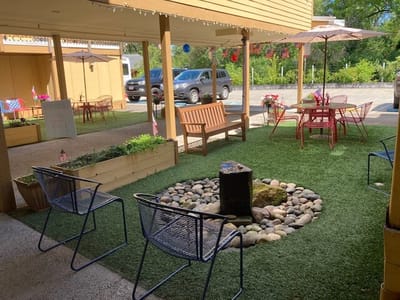 Outdoor patio area with seating and garden features