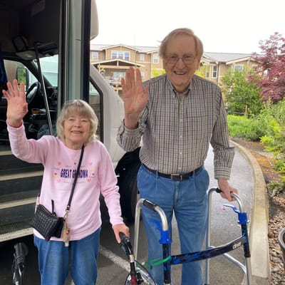 Residents waving outside the facility