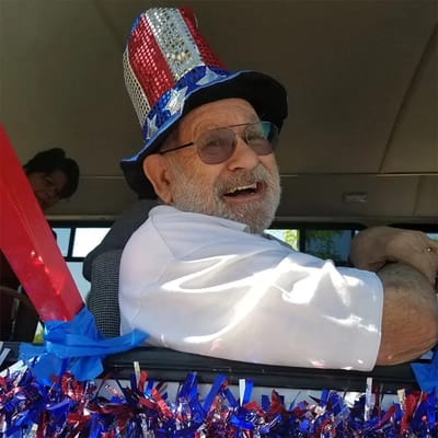 Resident celebrating with a patriotic hat and decorations
