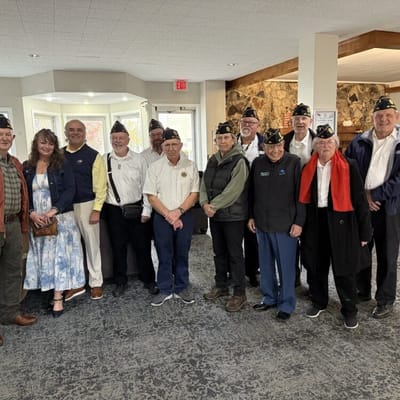 Group of residents and staff posing in a common area