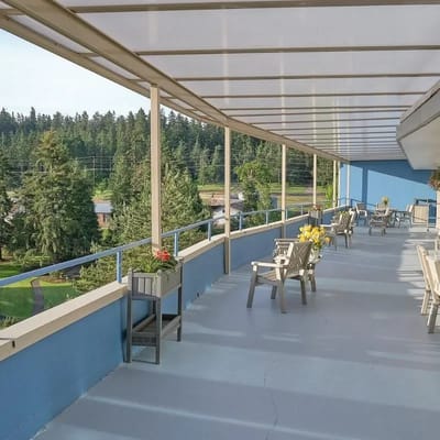Outdoor balcony with seating and flower boxes