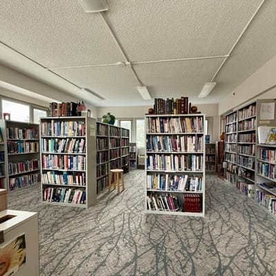 Interior view of a facility library with bookshelves