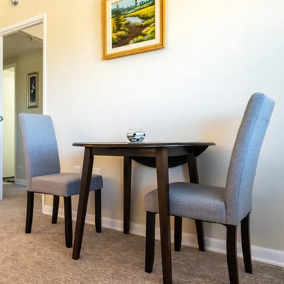 Small dining area with a table and two chairs