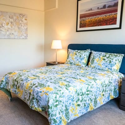 Brightly decorated resident bedroom with floral bedding