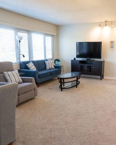 Cozy common area with seating and a TV