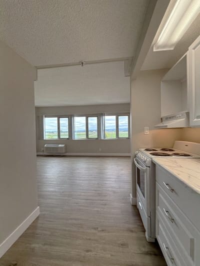 Interior view of a residential living space with kitchen
