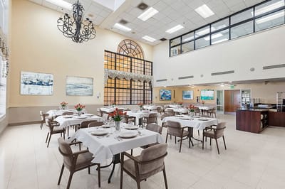 Dining area with tables set for a meal