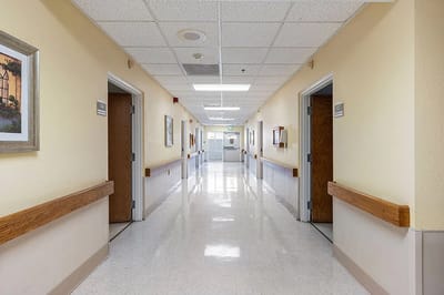 Hallway with resident rooms and artwork