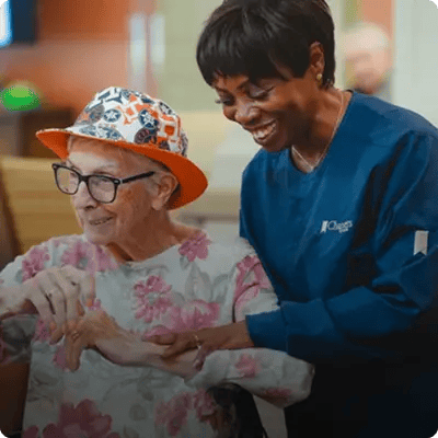 Resident and staff member interacting in an engagement activity.