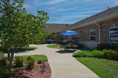 Outdoor seating area with pathways and landscaping