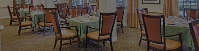 Dining area with tables and chairs set for a meal