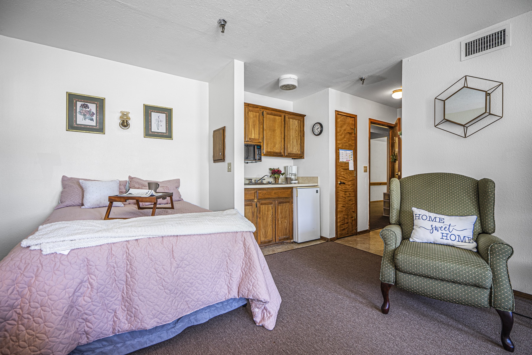 Cozy resident room with a bed and chair