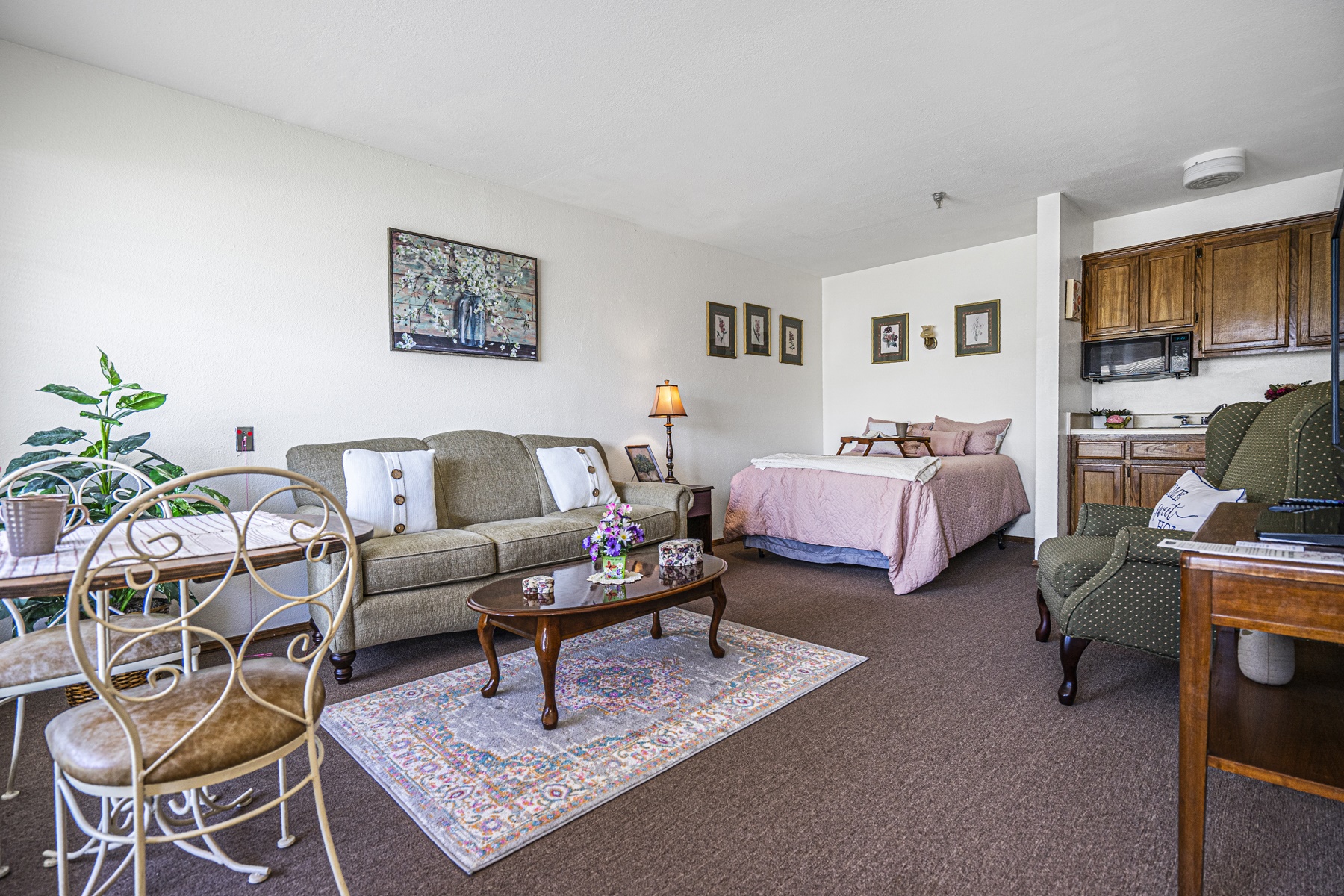 Cozy resident room with seating and kitchenette