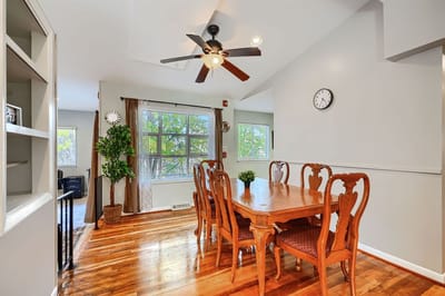 Bright interior dining area with wooden table and chairs