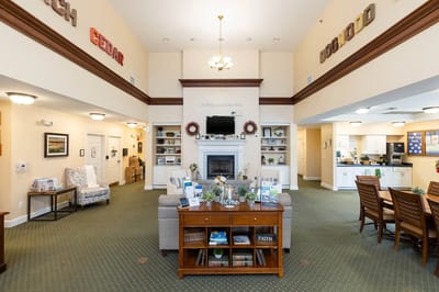 Bright common area with seating and a fireplace
