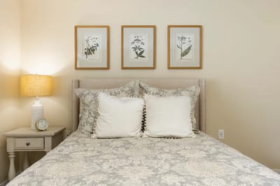 Cozy resident room with decorative pillows and wall art