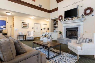 Cozy interior of a common area with seating and fireplace