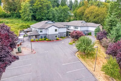 Aerial view of a senior living facility with landscaped gardens