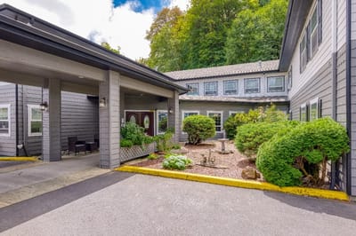 Exterior view of the facility entrance and garden area