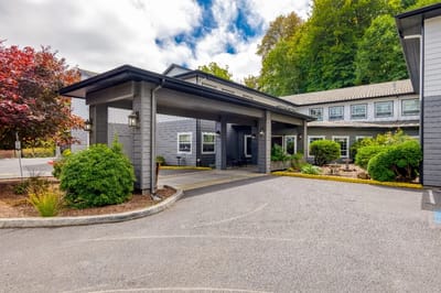 Entrance of The Amber Senior Living facility with landscaping