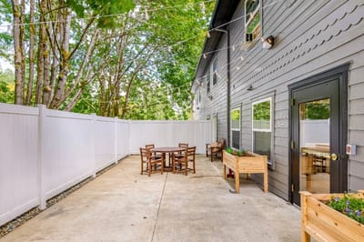 Outdoor patio area with seating and plants