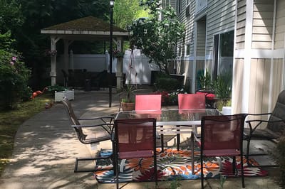 Outdoor seating area with a gazebo and garden