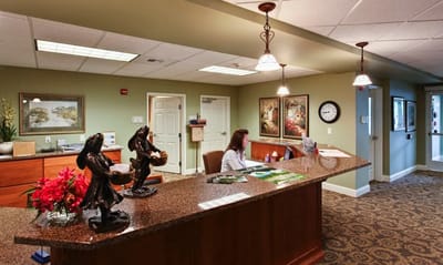 Reception area with staff and decorative elements