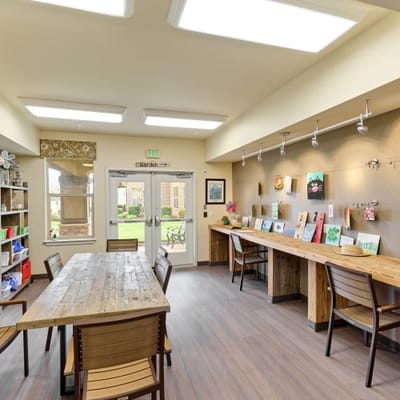 Bright and inviting activity room with artwork displays