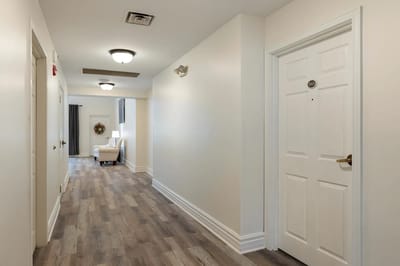 Bright hallway leading to resident rooms