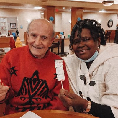 Residents enjoying dessert together in a common area